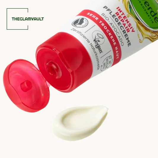 Open tube of Intensiv Repare Creme with a drop of cream on a white background, featuring the brand 'erde'.