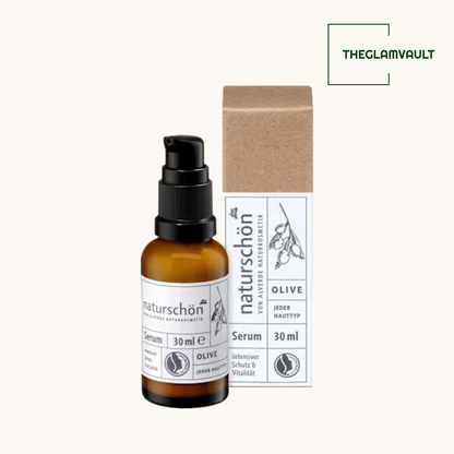 Brown serum bottle with label and brown box on white background, featuring 'THEGLAMVAULT' brand.