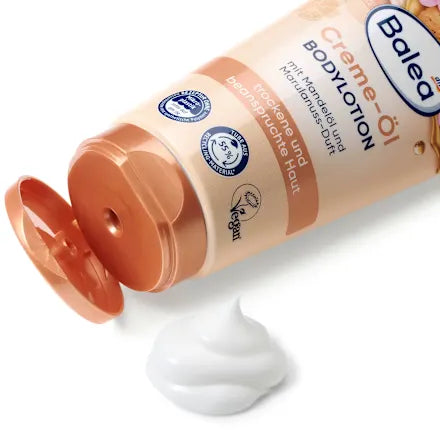 Balea body lotion with cream on a white background