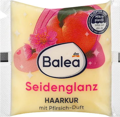 Balea hair care product packaging with apricot illustration and 'Seidenglanz' text.