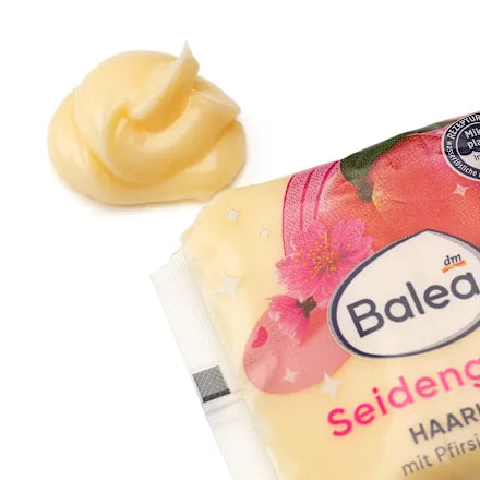 Balea hair butter packaging with a swatch of product on a white background