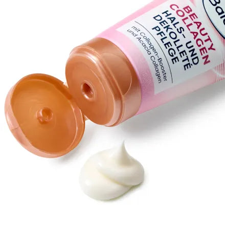 Open tube of cosmetic cream with visible cream on a white background